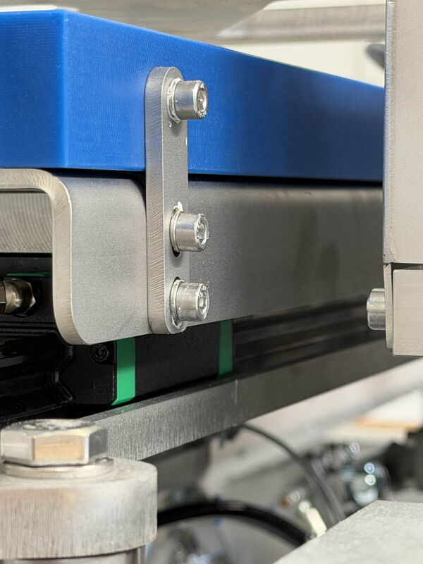 Stainless-steel mounting bracket on the Rivo +load conveyor frame